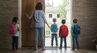 © Tiaga - Mother Standing At Front Door Encouraging Children Ready To Leave House For School
