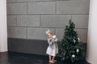 © kuzmichstudio - Little beautiful child girl in a bunny costume at Christmas