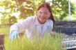 © YaMo - A young woman is experimenting and analyzing about the cultivation of rice and agricultural crops.