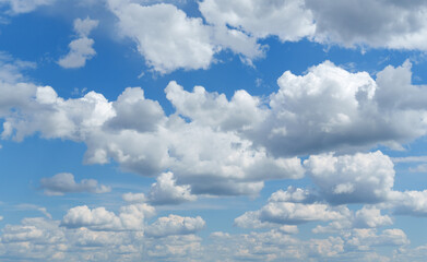 Wall Mural - a beautiful blue sky with soft white clouds for abstract background