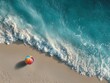 © ma - Aerial top-down view of colorful beach ball on sandy shore with turquoise ocean waves at tropical island, summer vacation theme for travel promotion, social media cover or background design