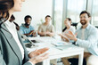 © Maria Vitkovska - Businesswoman receiving applause after presentation in meeting room selective focus on hands