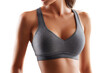 © Iana - athletic woman body in grey sport bra isolated on white background