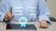© vittaya - Digital Checklist Verification with Businessman Using Tablet and Approval Symbol
