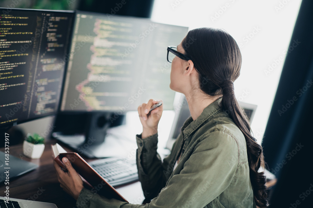 Charming programmer working remotely in a modern workspace while ...