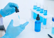 © Obsure - Scientist Handling Blue Liquid with Pipette and Test Tubes in Laboratory Experiment Process