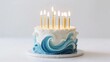 © Andy - Birthday cake with ocean wave design and lit candles