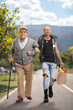 © Ljupco Smokovski - Punk helping an elderly man with a cane and carrying grocery bags in a park