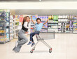 © Ljupco Smokovski - Mother running and pushing a kid in a shopping cart