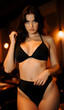 © Maikel - Beautiful woman in black lingerie with blue eyes and dark hair, elegant pose with soft lighting