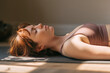© Pixel Pantry - A person practicing progressive muscle relaxation lying on a yoga mat, eyes closed, complete calm, home environment, peaceful