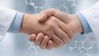 © 69 - Professional handshake between two individuals in lab coats, representing collaboration in scientific research and teamwork in the medical field
