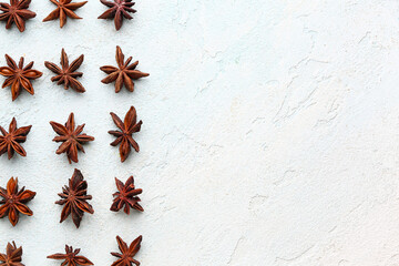 Wall Mural - Composition with aromatic star anise on light background