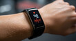 © Wlady Widia - Close-up of a sweaty arm wearing a fitness tracker displaying a high heart rate