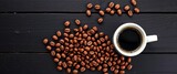 White lungo cup, hot coffee, toasted beans scattered on rustic black wood Copy space,  rustic,  food