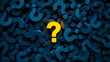 © FATIHAKHANDOKER - A conceptual image featuring a vibrant yellow question mark amidst a sea of blue question marks