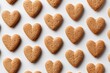 © Wandi - Heart-shaped cookies arranged in a grid pattern on a white surface (1)