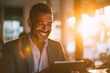 © EricMiguel - Smiling businessman using a tablet in golden-hour sunlight — warm backlit portrait of a professional enjoying digital work and café productivity
