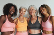 © EricMiguel - Multigenerational group of smiling women in colorful activewear celebrating fitness, confidence, empowerment and body positivity together
