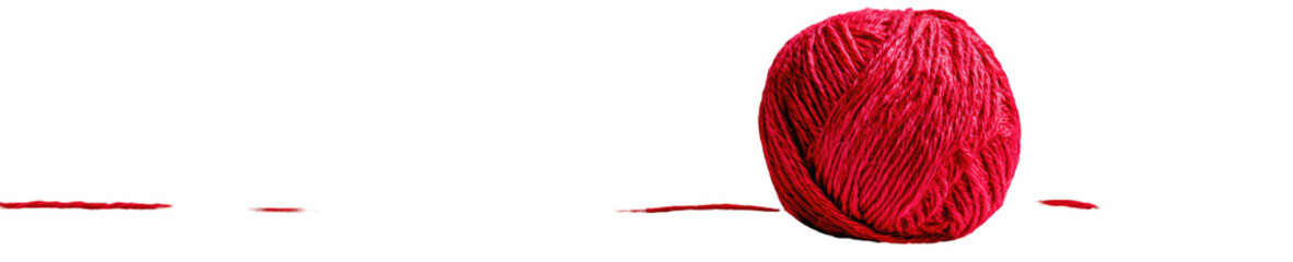 Red circular object on a black background.  Textured surface