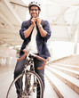© Nassorn - Smart businessman ride bicycle in downtown. Environmentalist commuting by cycling reduce carbon footprint global warming. Bike to work eco friendly alternative transportation green energy vehicle