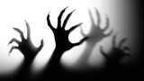 silhouette of hands in spotlight,Shadow overlay effect for halloween background with Terrifying scary hands with long nails,Creepy monster claw,silhouette of hands,zombie hand rising out of a graveyar