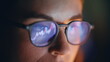 © stockbusters - Diagrams woman glasses reflection closeup. Market trader face looking charts