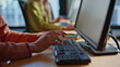 © stockbusters - Telesales worker hands typing computer taking online order in office closeup