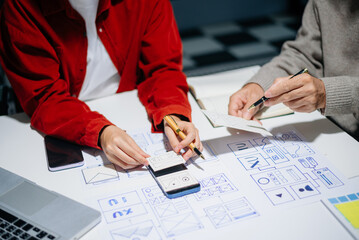 Wall Mural - UX graphic designer planning application process development prototype wireframe for web smart phone. Creative digital development agency.