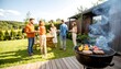 © hi - Outdoor barbecue party in a garden