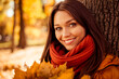 © deagreez - Beautiful young woman enjoying an autumn day in the park with colorful foliage and warm sunlight