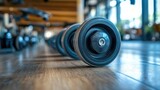 Gym equipment wheels on wooden floor, fitness center background