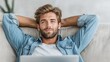 © ERiK - Handsome man relaxing on sofa modern lifestyle concept