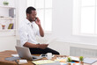 © Prostock-studio - African-american businessman in office making business call