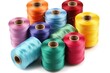 © Маргарита Вайс - Close-up image of colorful spools of thread isolated on white, providing clean, crisp visual for use in pattern design, online marketplaces and instructional materials