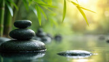 Stack of wet zen stones near bamboo leaves reflection in calm water. Natural spa setting, soft sunlight. Perfect backdrop for wellness products, aromatherapy, relaxation and meditation.