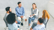 © Prostock-studio - Psychological support group. Diverse happy people sitting in trust circle on therapy session, discussing their achievement in recovery