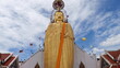 Low angle view of a buddha statue against sky