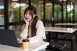 © snowing12 - Asian woman remote work outdoor cafe freelance professional productivity digital nomad internet coffee laptop computer student study business tech lifestyle