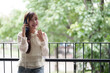 © snowing12 - Asian adult woman talking on phone outdoors freelancer remote work communicate business modern mobile lifestyle happy joyful successful career connectivity digital nomad