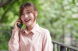 © snowing12 - Asian Woman Adult Works Outdoors Communicates Mobile Phone Connects With Business Remote Professional Happy Smile Lifestyle