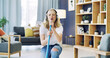 © peopleimages.com - Home, cleaning and woman with broom, singing and dancing with headphones, song and hygiene. Apartment, radio and person in lounge, music and streaming audio with energy, housekeeping and karaoke