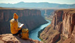 © Vadym - Woman in yellow beanie reads book atop canyon overlooking river. Backpack sits beside. Scenic mountain landscape provides backdrop. Enjoying nature, solitude, outdoor adventure during sunny autumn