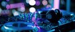 © Boh - The DJ headphones and mixer on a neon-lit nightclub controller for electronic dance music