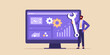 © Mityunjoy - Businessman holding a large wrench in front of a computer screen displaying analytics and gears