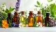 © zahra - Essential oil bottles with lavender and various herbs