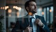 © KOTL - Confident Young Businessman Adjusts Tie in Modern Office with Soft Lighting