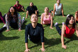 © Marcos - Group of latin sporty people practicing yoga lesson outdoors in Mexico Latin America, hispanic diverse group of mexican women and men multi-age in wellness concept