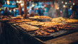 Food festival with food stall kiosk, open-air outdoor fair market, assortment of different traditional European grilled barbecued street food with sausages, bbq, chicken, pork and lamb on a large pan