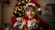 © blackmark - Joyful child in Santa hat unwraps Christmas present surrounded by festive lights and bokeh tree